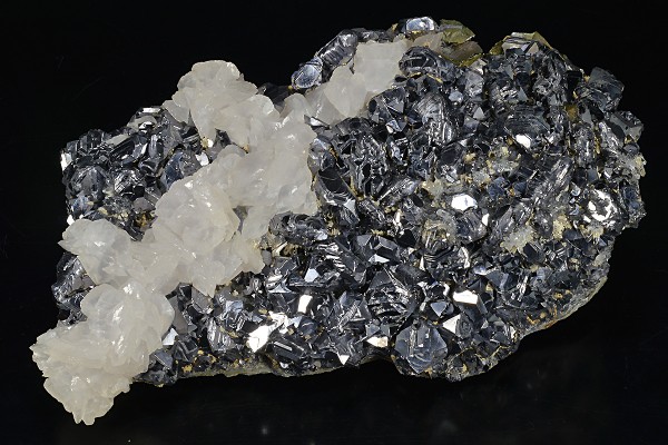 Rhombohedral Calcite set on twinned Galena, Chalcopyrite, Quartz
