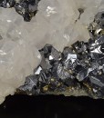 Rhombohedral Calcite set on twinned Galena, Chalcopyrite, Quartz
