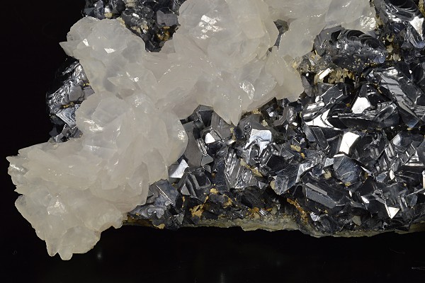 Rhombohedral Calcite set on twinned Galena, Chalcopyrite, Quartz
