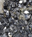 Rhombohedral Calcite set on twinned Galena, Chalcopyrite, Quartz