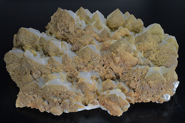 Hexagonal pyramidal Quartz tinged with Calcite