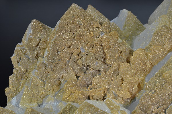 Hexagonal pyramidal Quartz tinged with Calcite