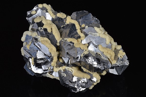 Twinned Galena tinged with Calcite