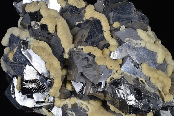 Twinned Galena tinged with Calcite