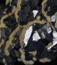 Twinned Galena tinged with Calcite