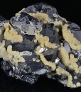 Twinned Galena tinged with Calcite
