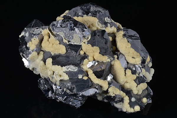 Twinned Galena tinged with Calcite