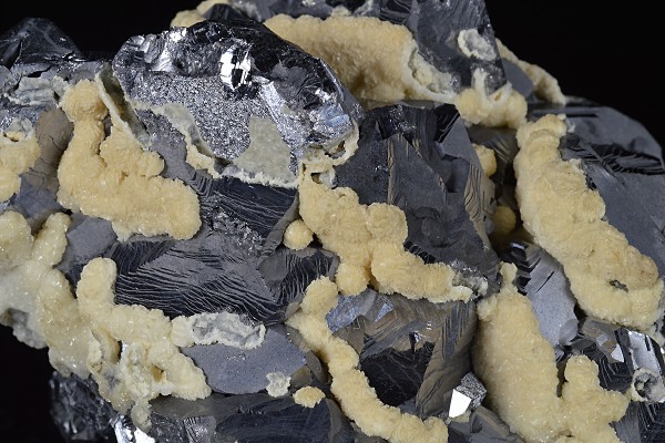 Twinned Galena tinged with Calcite