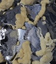 Twinned Galena tinged with Calcite