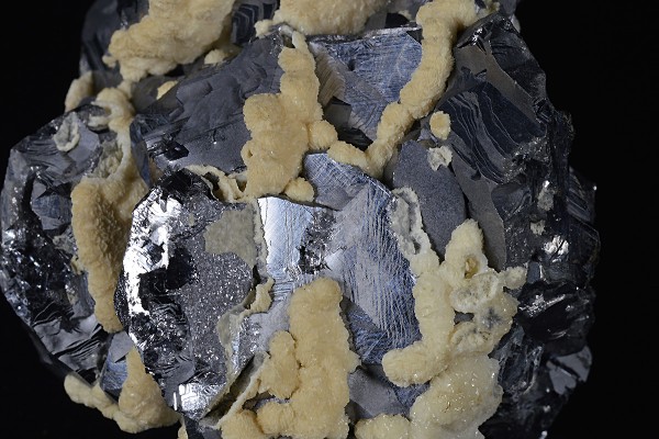 Twinned Galena tinged with Calcite