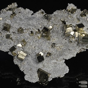 Pyrite on matrix on Quartz