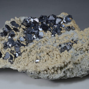 Twinned and truncated Galena on Quartz and Siderite