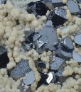 Twinned and truncated Galena on Quartz and Siderite